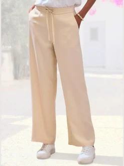Pantalon ample à poches fendues avec ceinture à cordon