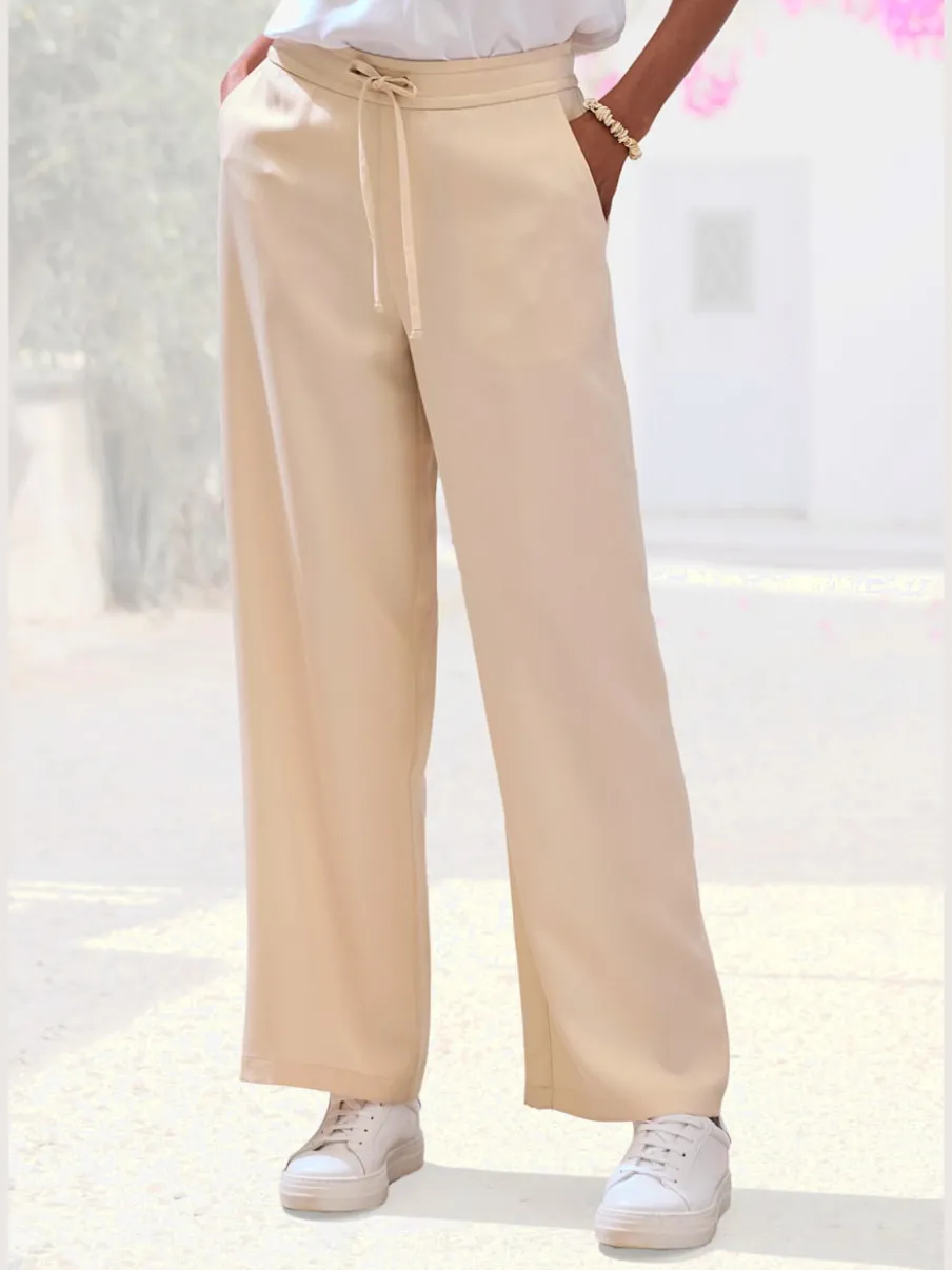 Pantalon ample à poches fendues avec ceinture à cordon