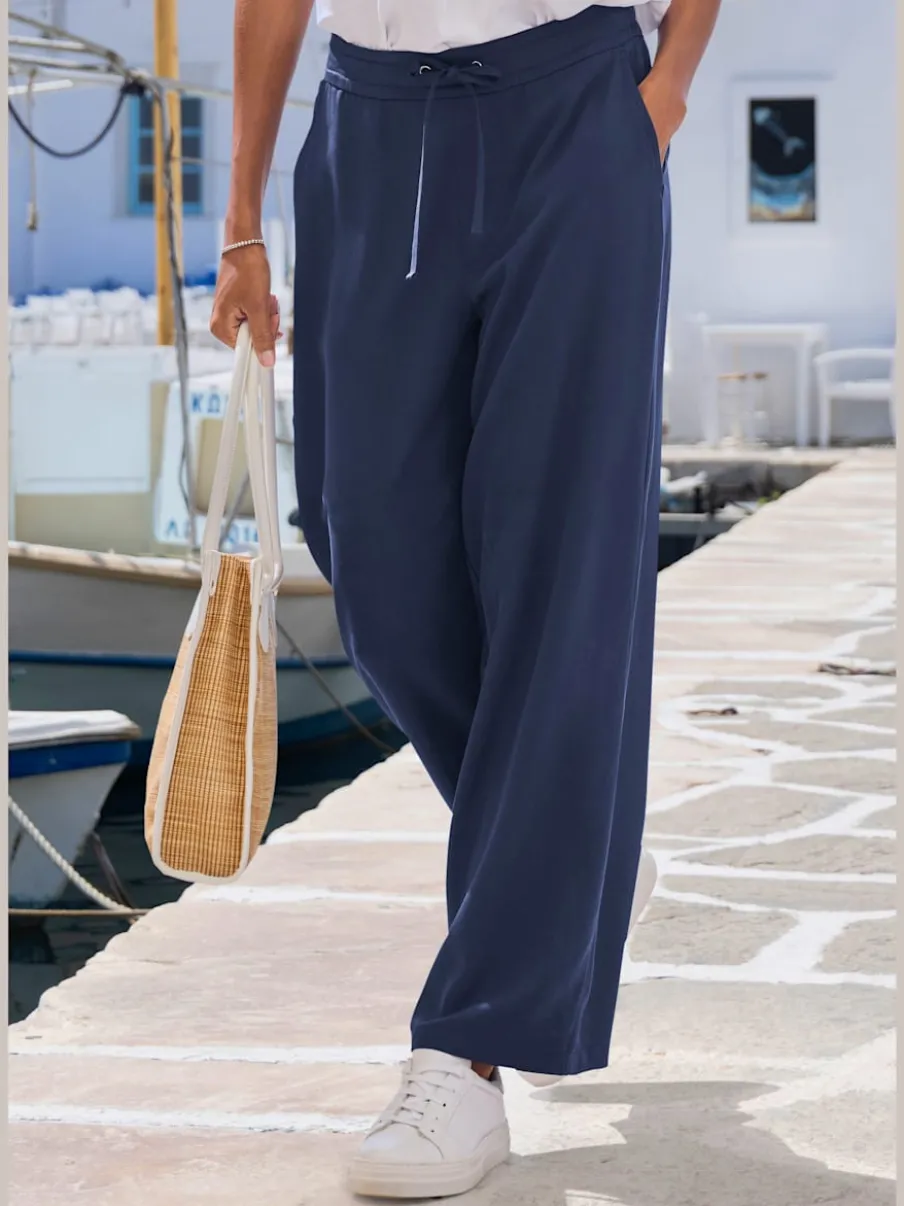 Pantalon ample à poches fendues avec ceinture à cordon