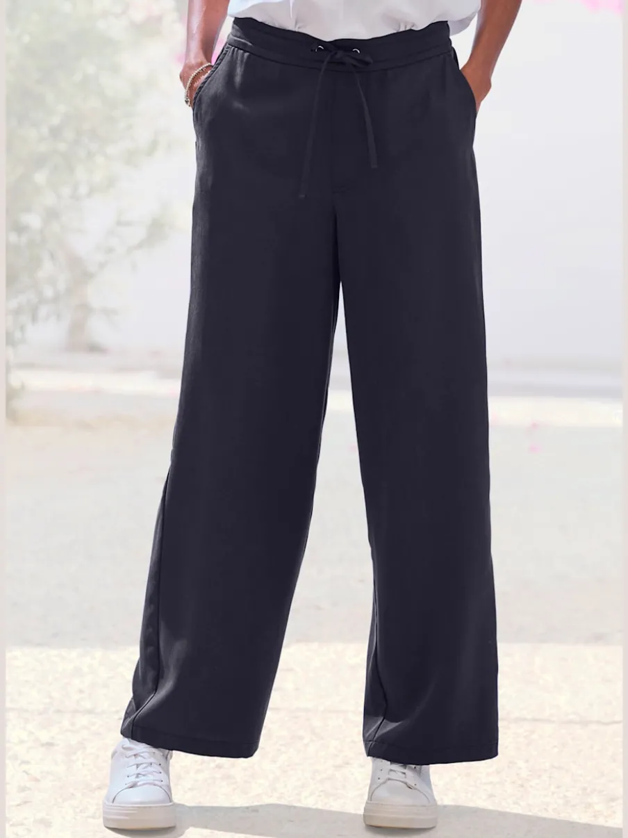 Pantalon ample à poches fendues avec ceinture à cordon