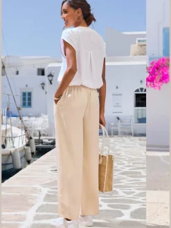 Pantalon ample à poches fendues avec ceinture à cordon