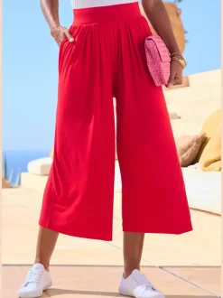 Pantalon avec large ceinture élastique et poches.