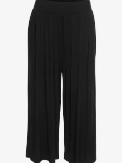 Pantalon avec large ceinture élastique et poches.