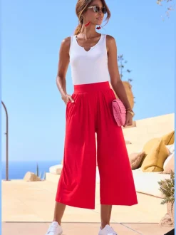 Pantalon avec large ceinture élastique et poches.
