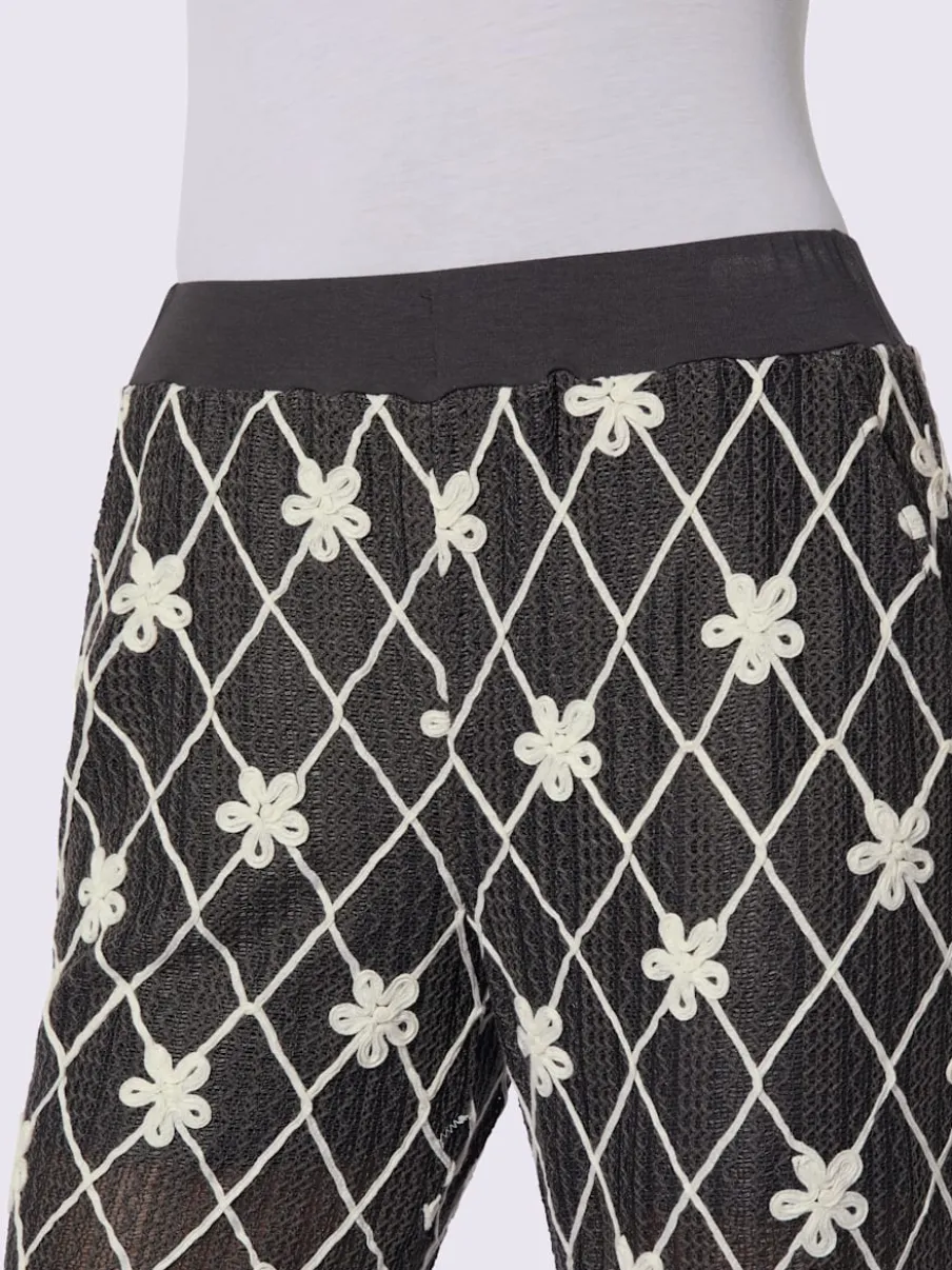 Pantalon avec motifs losanges et fleurs à ceinture élastique