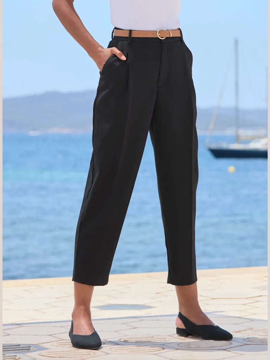 Pantalon à ceinture étroite avec poches fendues et jambes étroites
