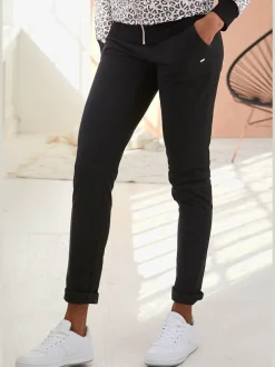 Pantalon confortable avec poches fendues et ourlet à revers