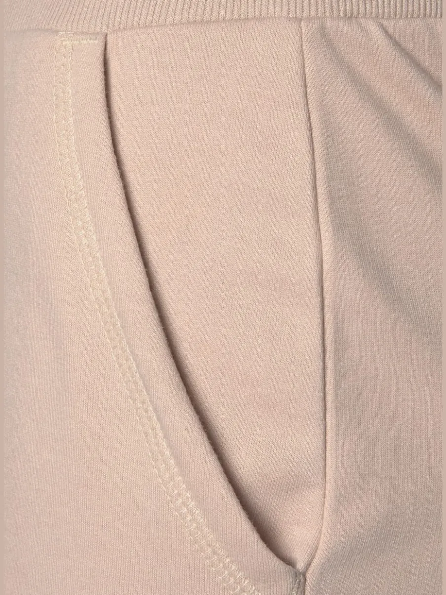 Pantalon confortable avec poches fendues et ourlet à revers