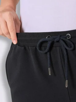 Pantalon court en matière sweat avec passepoil double sportif et ceinture élastique