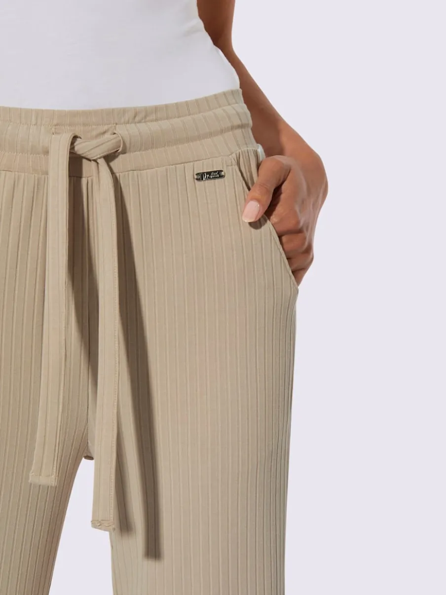 Pantalon côtelé confortable avec ceinture élastique et empiècements sportifs