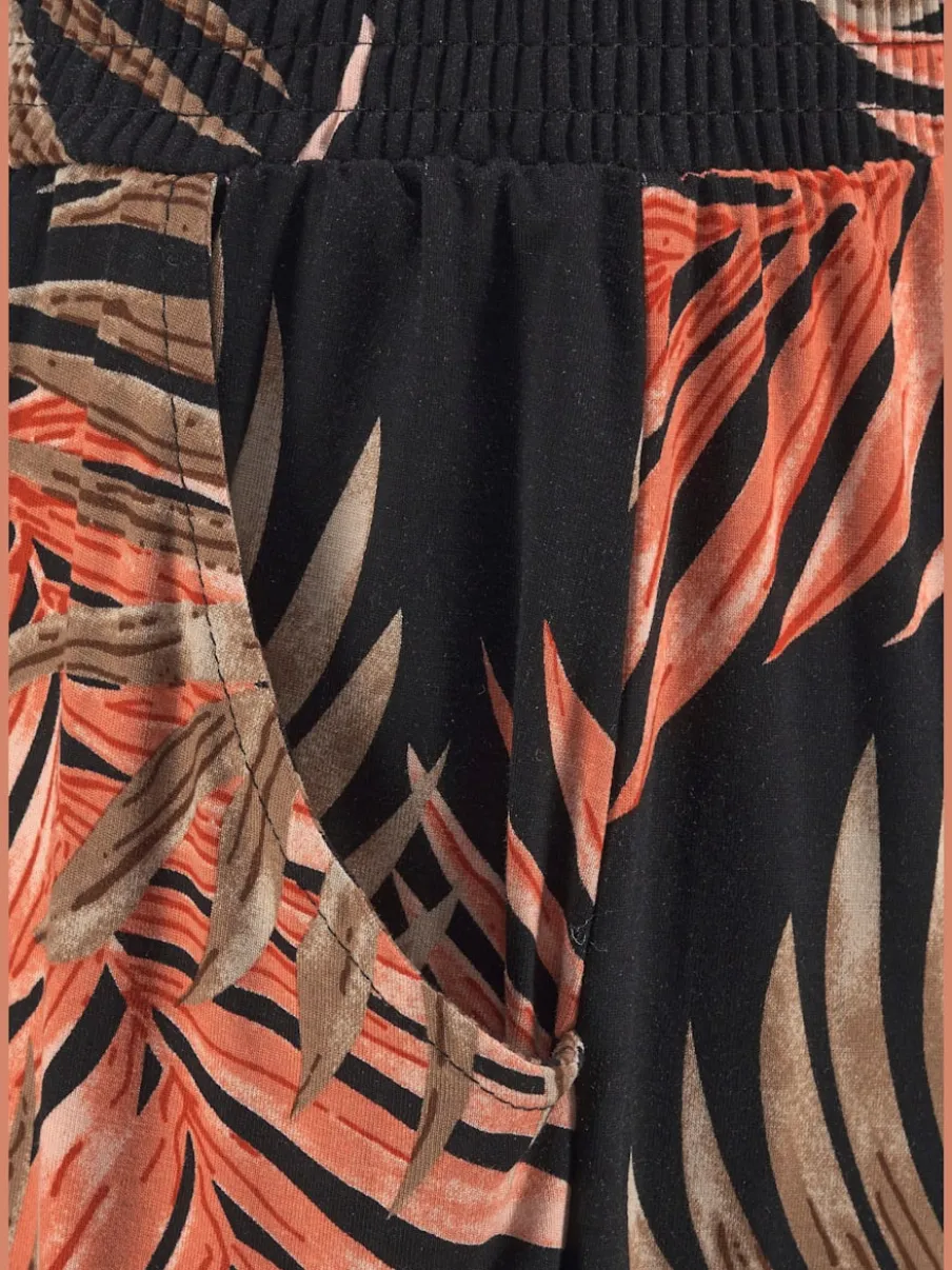 Pantalon de plage avec imprimé feuilles de palmier et poches fendues