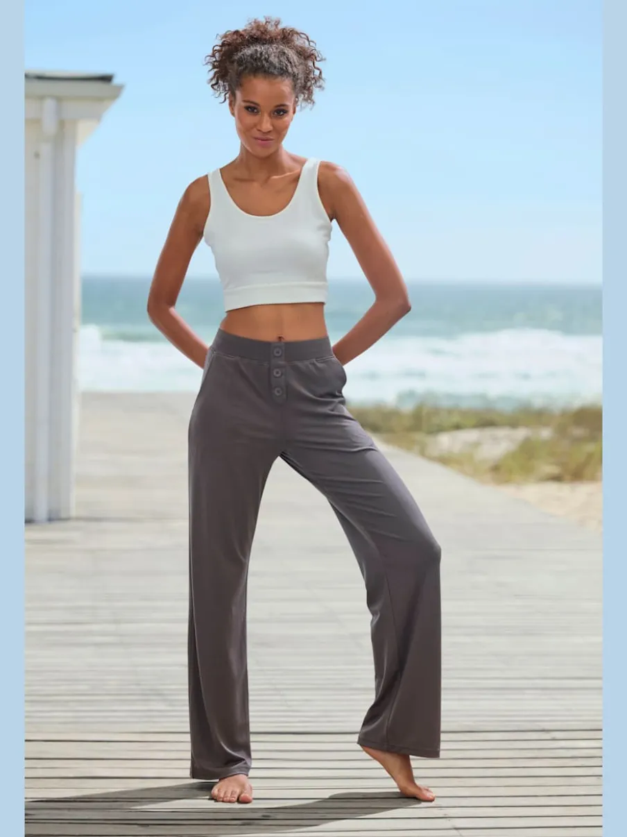 Pantalon détente en matière douce avec jambes droites et patte de boutonnage