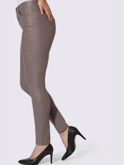Pantalon effet ventre plat avec coupe skinny et brillance raffinée