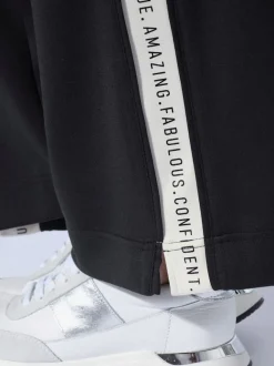 Pantalon en jersey avec rayures contrastées et poches latérales