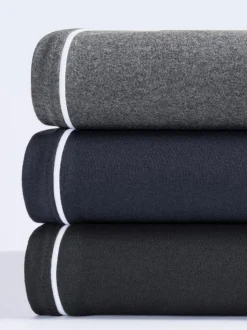 Pantalon en matière sweat avec ceinture élastique et passepoil sportif