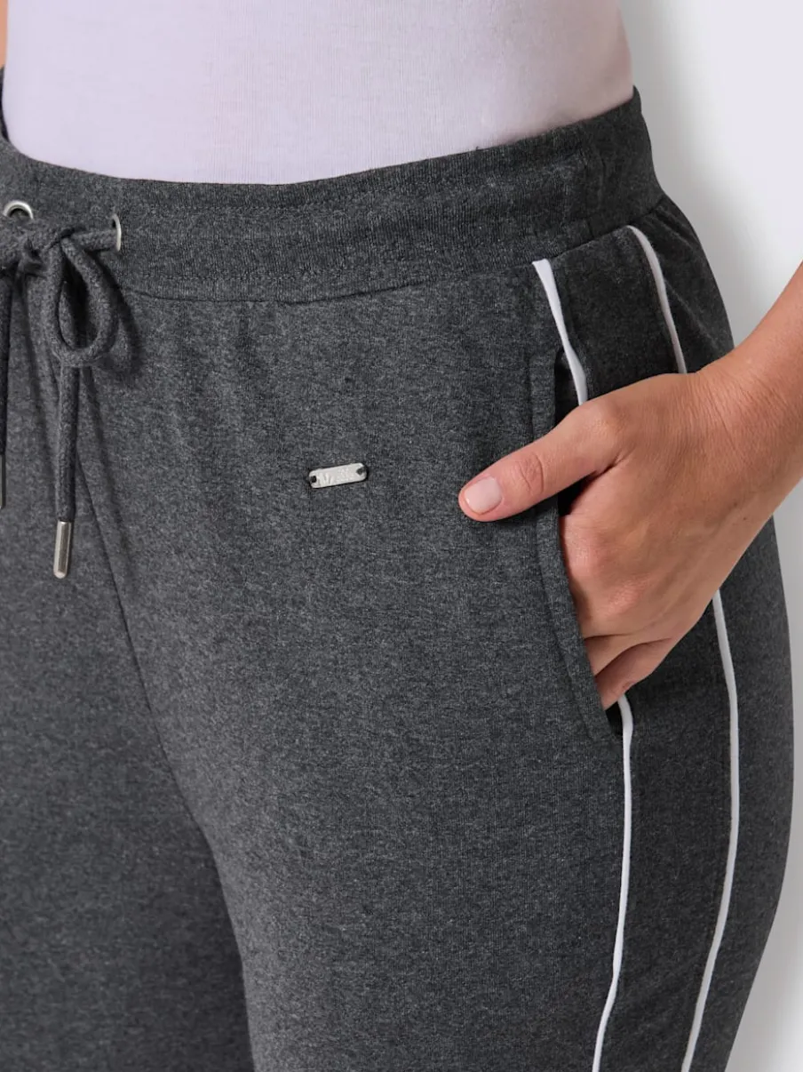 Pantalon en matière sweat avec ceinture élastique et passepoil sportif