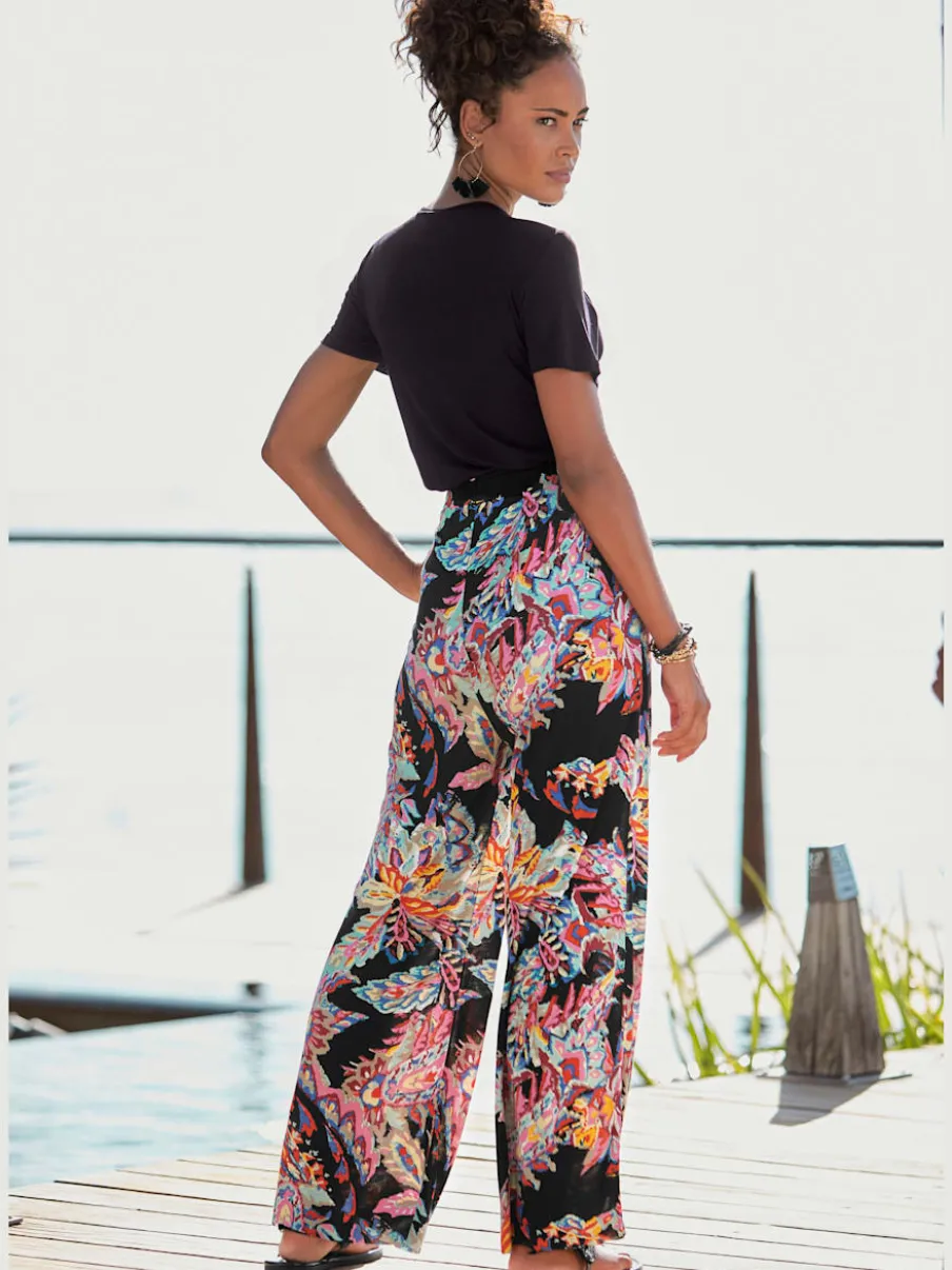 Pantalon fluide avec ceinture élastiquée et imprimé coloré