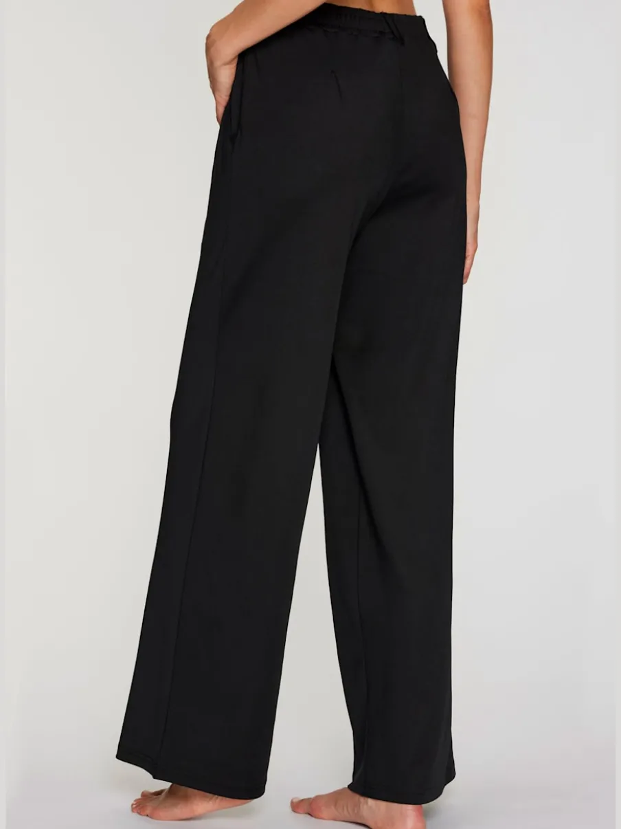 Pantalon fluide à taille haute avec poches latérales et jambes larges