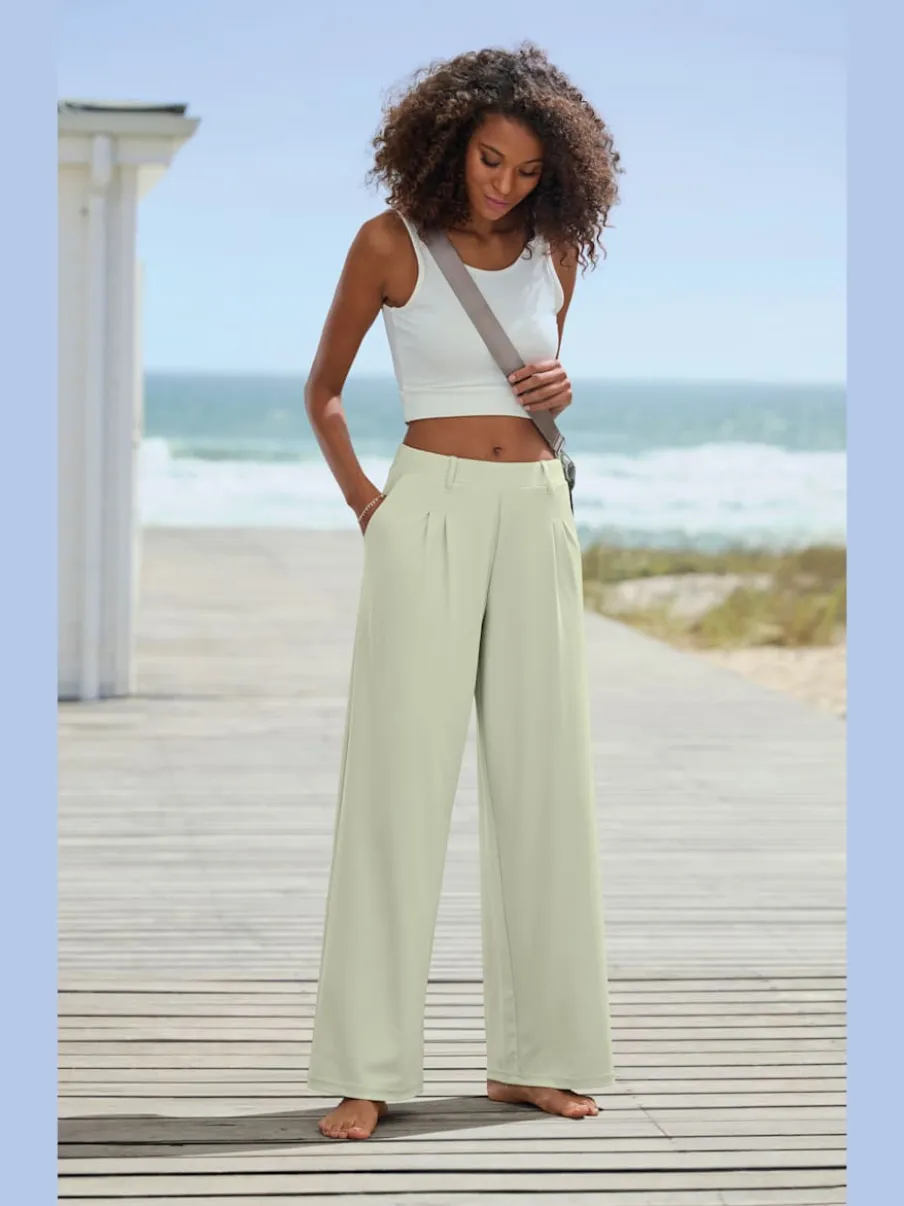 Pantalon fluide à taille haute avec poches latérales et jambes larges