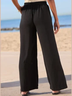 Pantalon à jambes extra-amples avec poches latérales smockées