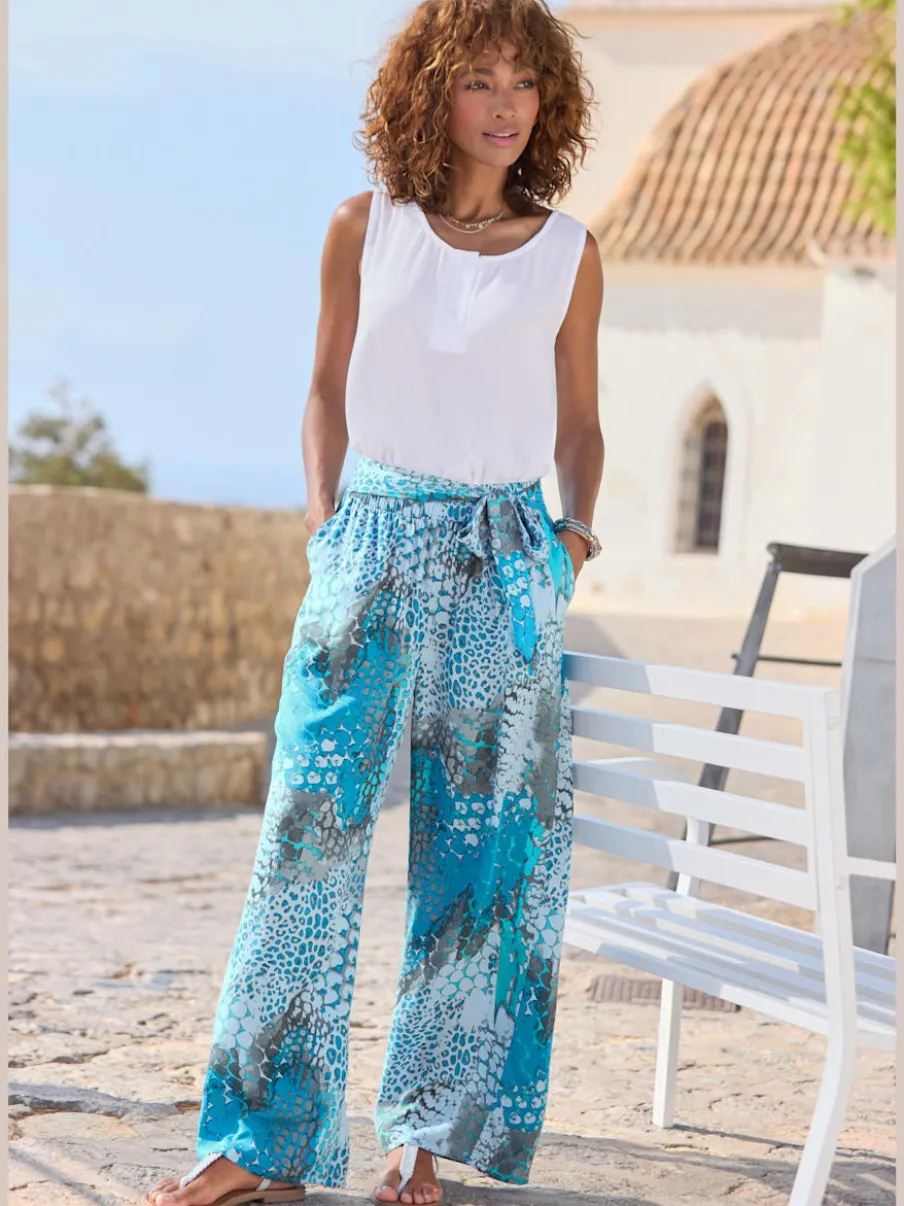 Pantalon large avec ceinture à nouer et poches pratiques