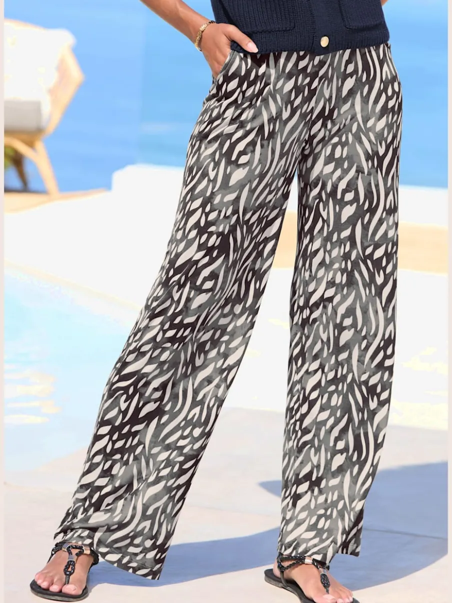 Pantalon large avec ceinture élastique et poches fendues