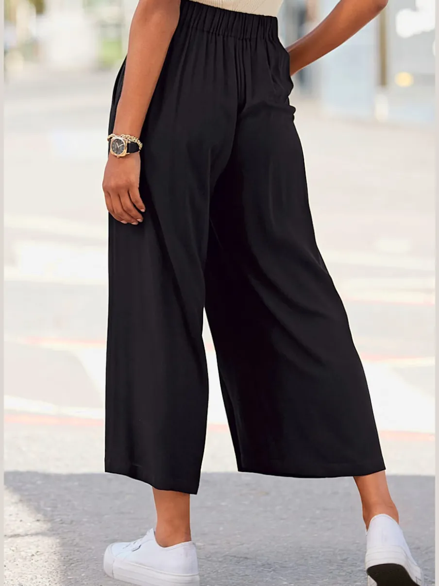 Pantalon large avec ceinture élastique et poches fendues