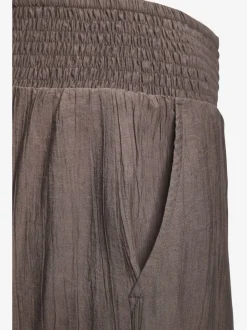 Pantalon large avec ceinture smockée et poches fendues