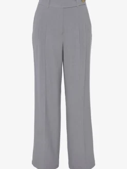Pantalon large avec pinces à poches fendues et décoratives