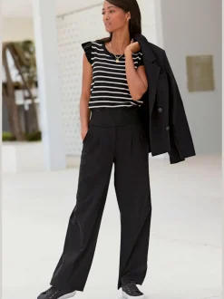 Pantalon large avec pinces à poches fendues et décoratives