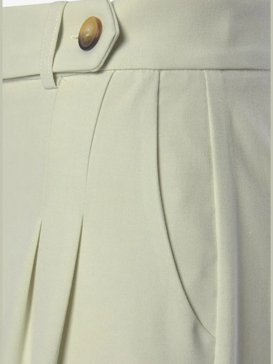 Pantalon large avec pinces à poches fendues et décoratives