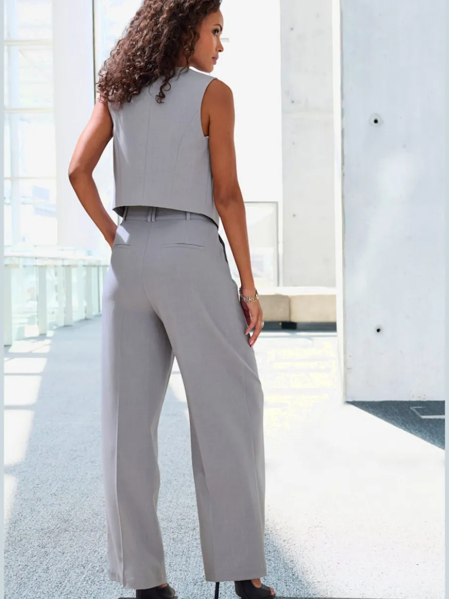 Pantalon large avec pinces à poches fendues et décoratives