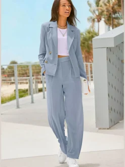Pantalon large avec pinces à poches fendues et décoratives