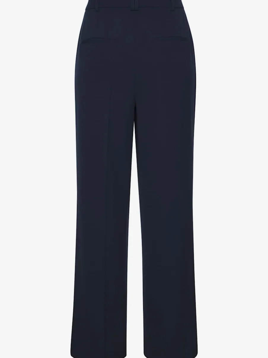 Pantalon large avec pinces à poches fendues et décoratives
