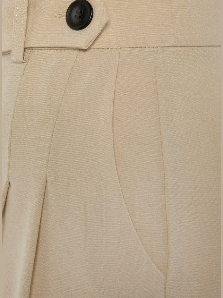 Pantalon large avec pinces à poches fendues et décoratives