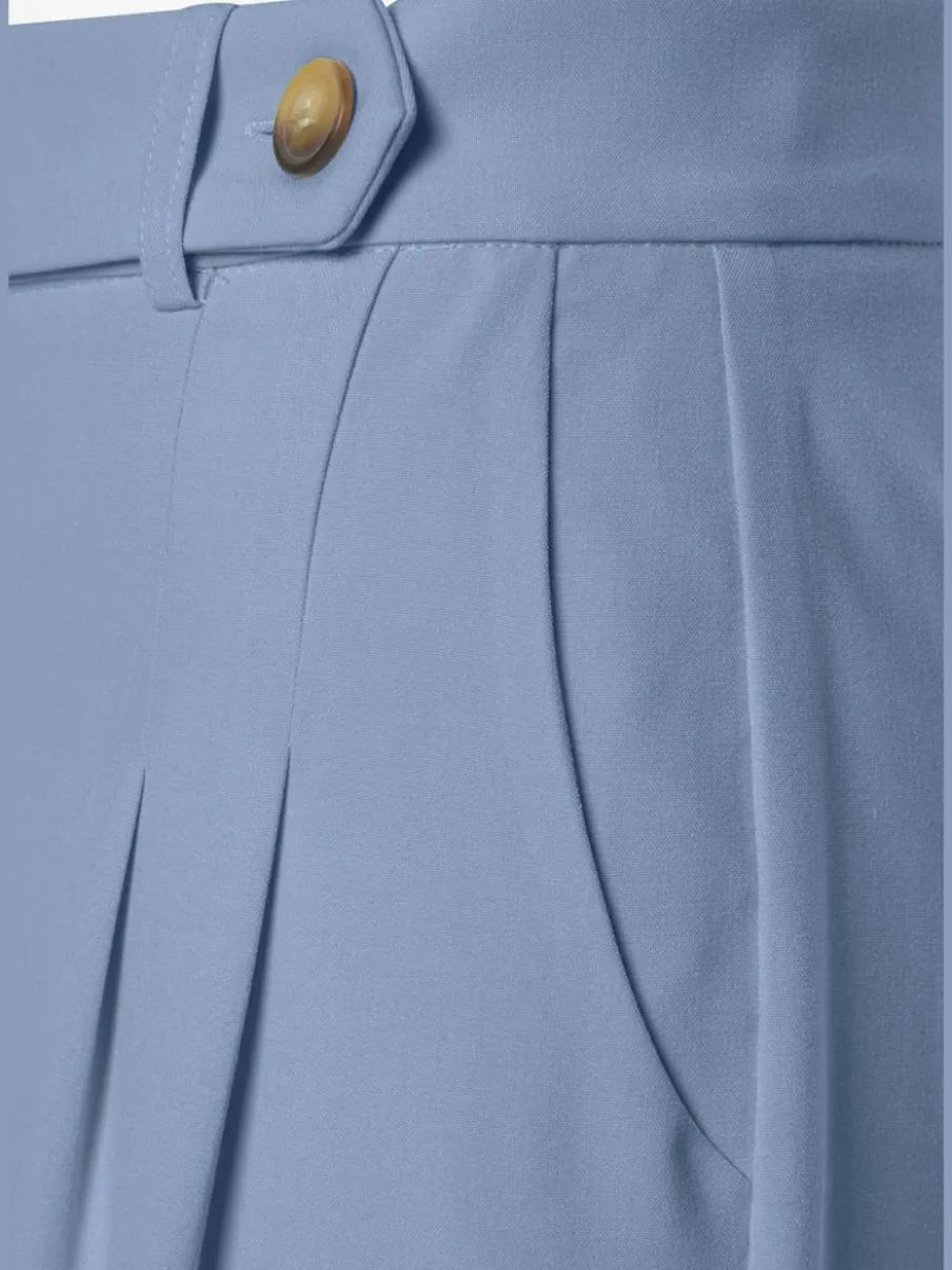 Pantalon large avec pinces à poches fendues et décoratives
