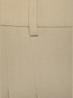 Pantalon large avec pinces à poches fendues et décoratives