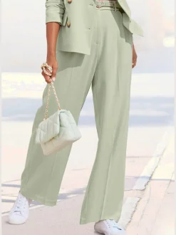 Pantalon large avec pinces à poches fendues et décoratives
