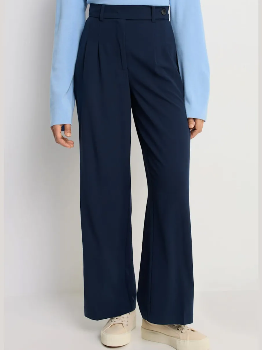 Pantalon large avec pinces à poches fendues et décoratives
