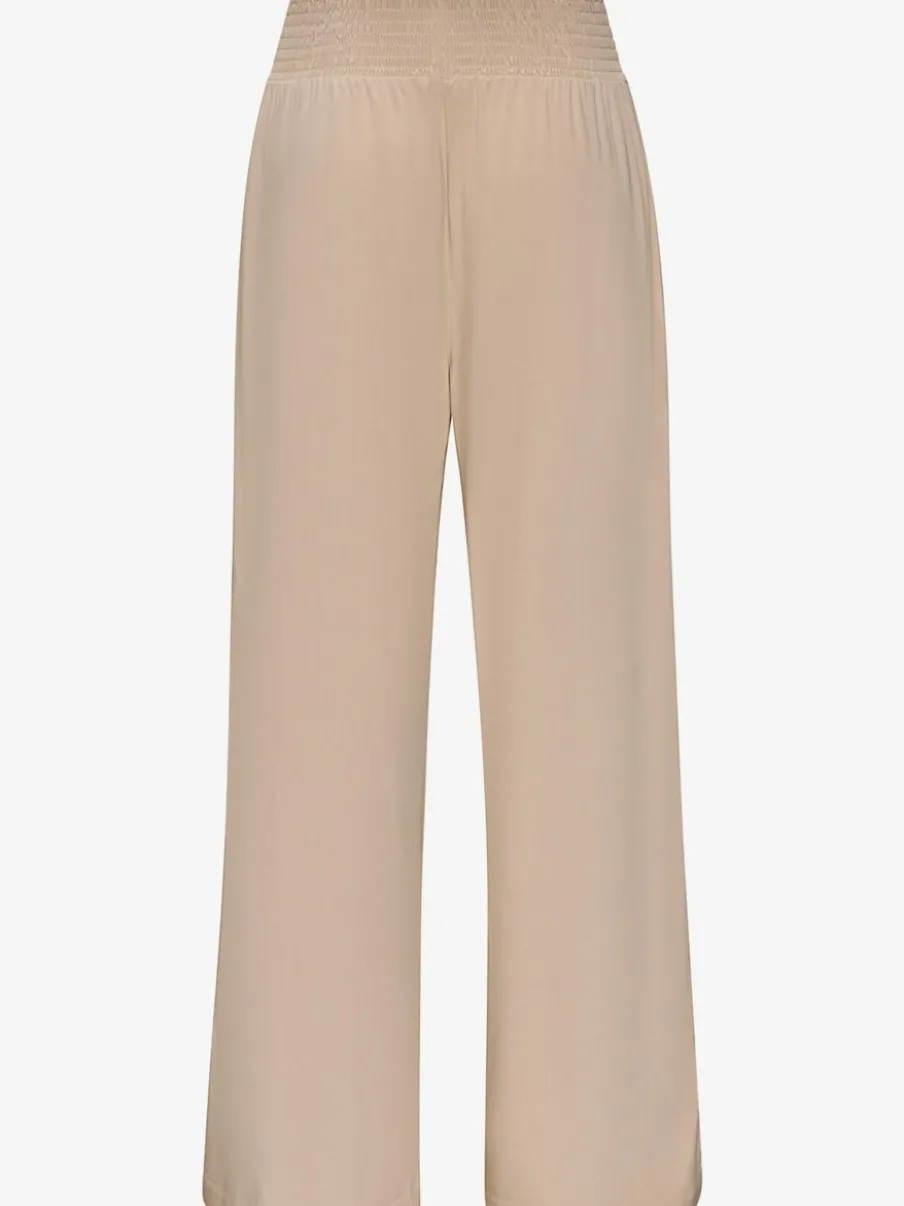 Pantalon large avec poches latérales et détails smockés