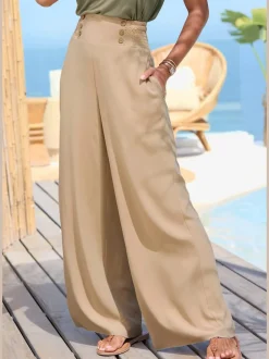 Pantalon large avec poches latérales et détails smockés