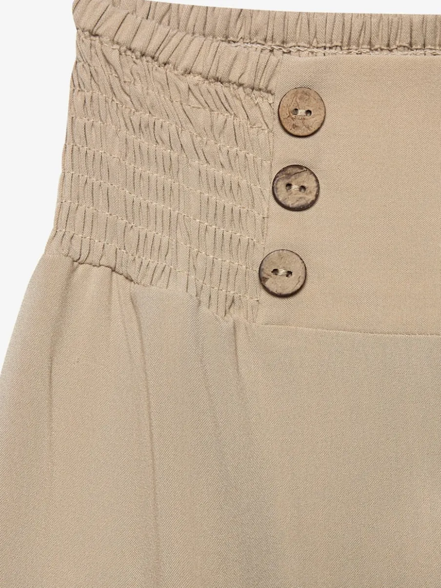 Pantalon large avec poches latérales et détails smockés