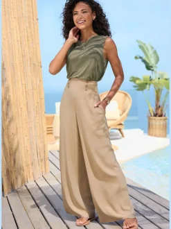 Pantalon large avec poches latérales et détails smockés