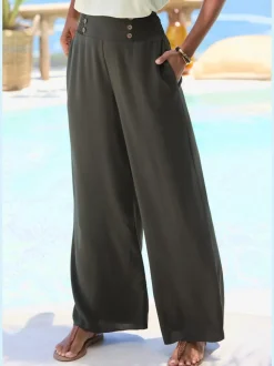Pantalon large avec poches latérales et détails smockés