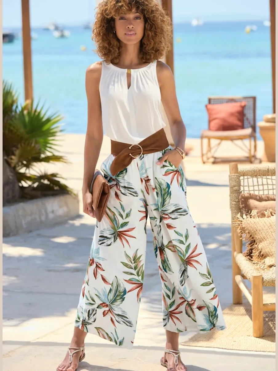 Pantalon large à ceinture plate avec poches fendues et imprimé floral