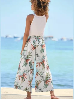 Pantalon large à ceinture plate avec poches fendues et imprimé floral