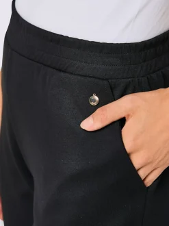 Pantalon large en modal avec empiècement en résille et poches
