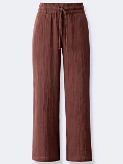 Pantalon large en mousseline avec taille haute et poches