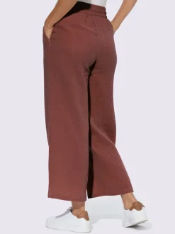 Pantalon large en mousseline avec taille haute et poches