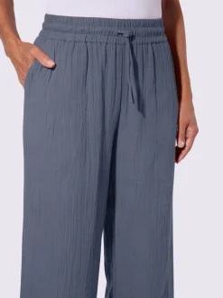 Pantalon large en mousseline avec taille haute et poches